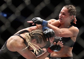Katlyn Chookagian (L) of the United States fights against Jessica Eye of the United States in a flyweight bout during the UFC 231 event at Scotiabank Arena on Dec. 8, 2018 in Toronto.