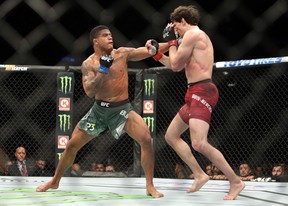 Olivier Aubin-Mercier (R) of Canada fights against Gilbert Burns of Brazil in a lightweight bout during the UFC 231 event at Scotiabank Arena on Dec. 8, 2018 in Toronto.