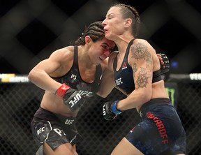 Claudia Gadelha (L) of Brazil fights against Nina Ansaroff of the United States in a strawweight bout during the UFC 231 event at Scotiabank Arena on Dec. 8, 2018 in Toronto.