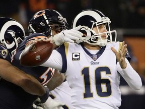 Quarterback Jared Goff #16 of the Los Angeles Rams gets the football stripped by Khalil Mack #52 of the Chicago Bears in the third quarter at Soldier Field on December 9, 2018 in Chicago, Illinois.