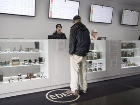 A customer shops for marijuana products at Eden Medicinal Society in Vancouver on Jan. 30, 2018. (THE CANADIAN PRESS)