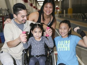 Joshua Delgado (left), Marianne Garcia and their children, Marlena and Lunalyse (in the wheelchair). Veronica Henri, Toronto Sun)