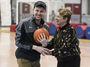Evan Fryer plays some basketball with his mom,  Betty Fryer, at Variety Village on Nov. 30. (Craig Robertson, Toronto Sun)