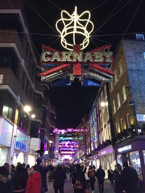 The neon lights over Carnaby Street are a tribute to the rock band Queen and feature lyrics from Bohemian Rhapsody. (ROBIN ROBINSON)