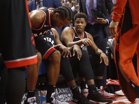 Toronto Raptors' Kyle Lowry (right) talks with teammate Kawhi Leonard during a game earlier this month. (JACK BOLAND/Toronto Sun)