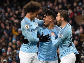 Manchester City's Gabriel Jesus (centre) celebrates scoring his team's first goal against Everton on Sunday. (GETTY IMAGES)