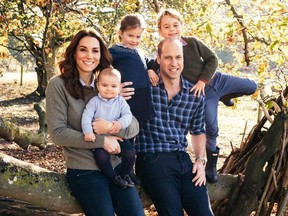 A handout picture released by Kensington Palace on December 14, 2018 shows Britain's Prince William, Duke of Cambridge, (2R) and Britain's Catherine, Duchess of Cambridge, (L) and their three children Prince Louis of Cambridge (2L), Princess Charlotte of Cambridge (C) and Prince George of Cambridge (R) posing for a photograph at Anmer Hall in Norfolk in the Autumn of 2018. - This photograph features on their Royal Highnesses' Christmas card this year.