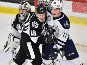 Samuel Desgroseilliers (10) of the Blainville-Boisbriand Armada and Alexis Lafreniere (11) of the Rimouski Oceanic battle for position during QMJHL action in Boisbriand, Que., on Nov. 23, 2018.