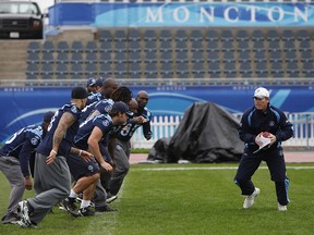 The Argos runs exercises during a walk through and light practice at the Moncton 2010 Stadium at the Universite de Moncton on September 25, 2010.