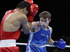 Canada’s Arthur Biyarslanov (right) fights Jordan’s Obada Alkasbeh at the 2016 Summer Olympics in Rio de Janeiro. Biyarslanov will make his pro debut tonight in Toronto. (AP FILE)