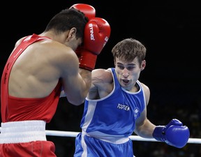 Canada’s Arthur Biyarslanov (right) fights Jordan’s Obada Alkasbeh at the 2016 Summer Olympics in Rio de Janeiro. Biyarslanov will make his pro debut tonight in Toronto. (AP FILE)