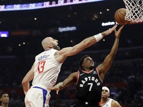 The Raptors' Kyle Lowry goes to the rim in a win over the Los Angeles Clippers on Tuesday night. (Marcio Jose Sanchez/The Associated Press)
