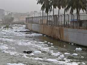 In this Monday, Dec. 10, 2018 photo toxic froth from industrial pollution floats on Bellundur Lake in Bangalore, India. As politicians haggle at a U.N. climate conference in Poland over ways to limit global warming, the industries and machines powering our modern world keep spewing their pollution into the air and water. The fossil fuels extracted from beneath the earth's crust _ coal, oil and gas _ are transformed into the carbon dioxide that is now heating the earth faster than scientists had expected even a few years ago.