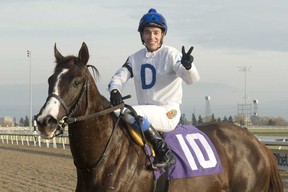 Jockey Luis Contreras, atop He’s a Macho Man, celebrates his 2,000th career victory at Woodbine Racetrack on Sunday. (Michael Burns/Photo)