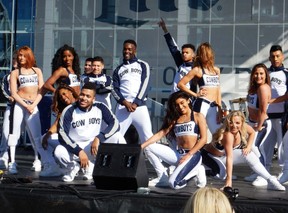 The Cowboy Dancers entertain at the pre-game party in the Miller Lite Plaza. (Steve MacNaull)