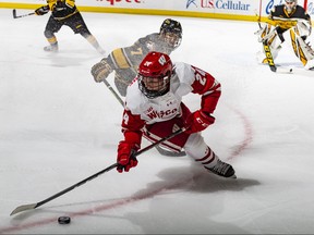 Sean Dhooghe (centre), in his sophomore year with the Wisconsin Badgers, leads the team in goals, power-play goals and shooting percentage. Despite his small stature, Dhooghe isn’t afraid to mix it up physically, too.TOM LYNN/UW ATHLETICS