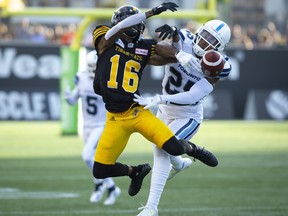 Hamilton Tiger-Cats wide receiver Brandon Banks (16) fails to make the catch while defended by Toronto Argonauts defensive back Ronnie Yell (25) during first half CFL Football game action in Hamilton, Ont. on Monday, September 3, 2018. THE CANADIAN PRESS/Peter Power