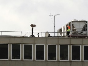 Counter drone equipment deployed on a rooftop at Gatwick airport as the airport and airlines work to clear the backlog of flights delayed by a drone incident earlier in the week, in Crawley, England, Saturday, Dec. 22, 2018. (Gareth Fuller/PA via AP)