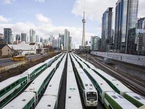 GO Train bi-level passenger coaches in downtown Toronto.