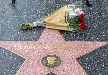 Fans leave tributes on Penny Marshall's star on the Hollywood Walk of Fame shortly after the news that the actress died aged 75 was made public, in Hollywood, California, on December 18, 2018. - Penny Marshall, the star of ABC's "Laverne and Shirley" who became one of the most successful female directors in history at the helm of "Big," "A League of Their Own" and a string of other hit movies, has died. She was 75. The filmmaker died peacefully in her Hollywood Hills on Monday, December 17, 2018 due to complications from diabetes, her publicist told AFP. (Photo by VALERIE MACON / AFP)        (Photo credit should read VALERIE MACON/AFP/Getty Images)