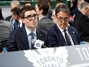 Kyle Dubas, left, and Brendan Shanahan of the Toronto Maple Leafs handle the draft table during the 2018 NHL Draft at American Airlines Center on June 23, 2018 in Dallas, Texas.  (Bruce Bennett/Getty Images)