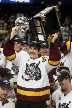 Darren Haydar holds up the Calder Cup trophy while playing with the Chicago Wolves in 2008. GETTY IMAGES FILE