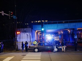 Police investigate the scene where two officers were killed after they were struck by a South Shore train near 103rd Street and Dauphin Avenue on Monday, Dec. 17, 2018, in Chicago. Police spokesman Anthony Guglielmi posted on Twitter that the "devastating tragedy" occurred when the officers were investigating a shots-fired call.