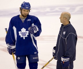 Maple Leafs’ Darcy Tucker takes some advice from assistant coach Keith Acton during practice. (POSTMEDIA FILES)
