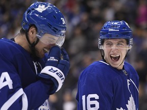 Toronto Maple Leafs right wing Mitchell Marner (16) and centre Auston Matthews (34) laugh after a goal against the Florida Panthers in Toronto on Thursday Dec. 20, 2018. (THE CANADIAN PRESS/Nathan Denette)