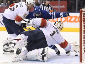 Florida Panthers goaltender Roberto Luongo reaches for the puck as Maple Leafs' Nazem Kadri kicks it into the net during the second on Thursday night in Toronto. (NATHAN DENETTE/THE CANADIAN PRESS)