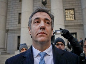 In this Nov. 29, 2018, file photo, Michael Cohen walks out of federal court in New York. The moment of reckoning has nearly arrived for Cohen, who finds out Wednesday, Dec. 12, whether his decision to walk away from President Donald Trump after years of unwavering loyalty will spare him from a harsh prison sentence.