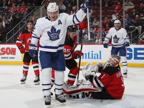 Maple Leafs forward Patrick Marleau (12) celebrates his first period goal against Devils goaltender Keith Kinkaid at the Prudential Center in Newark, N.J., on Tuesday, Dec. 18, 2018.