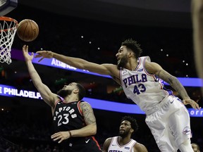 Toronto Raptors' Fred VanVleet (23) goes up for a shot against Philadelphia 76ers' Jonah Bolden (43) during the first half of an NBA basketball game, Saturday, Dec. 22, 2018, in Philadelphia. (AP Photo/Matt Slocum) ORG XMIT: PXC206