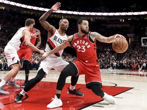 Toronto Raptors guard Fred VanVleet, right, tries to get past Portland Trail Blazers guard Damian Lillard, left, during the first half of an NBA basketball game in Portland, Ore., Friday, Dec. 14, 2018. (AP Photo/Steve Dykes)