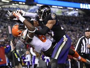 Cleveland Browns tight end David Njoku, left, is unable to hold onto a catch on a pass attempt as he is pressured by Baltimore Ravens cornerback Marlon Humphrey in the end zone yesterday. AP