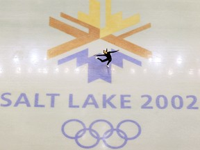 This Feb. 8, 2002, file photo, shows U.S. champion Michelle Kwan practicing for the women's short program for the Winter Olympic Games at the Salt Lake Ice Center in Salt Lake City. (AP Photo/Doug Mills, file)