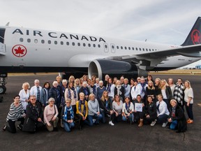 Moms of Maple Leafs players and staff members gather for a photo outside their plane on Dec. 12, 2018. (TORONTO MAPLE LEAFS PHOTO)