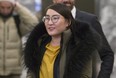 Nadia Guo leaves for a lunch break after appearing before a hearing of the Law Society, on Thursday Dec. 13, 2018.