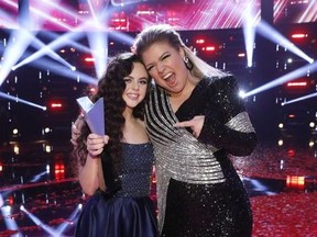 This photo provided by NBC shows "The Voice" finalist, Chevel Shepherd, left, for season 15, and singer Kelly Clarkson Tuesday, Dec. 18, 2018, in Universal City, Calif. (Trae Patton/NBC via AP) ORG XMIT: CAET502