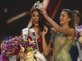 Miss Universe 2017 Demi-Leigh Nel-Peters, of South Africa, right, crowns new Miss Universe Catriona Gray, of Philippines, during the final of 67th Miss Universe competition in Bangkok, Thailand, Monday, Dec. 17, 2018.