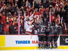 Canada's Markus Phillips, from left to right, Jack Studnicka, Alexis Lafreniere, back centre, Josh Brook and MacKenzie Entwistle celebrate Lafreniere's goal against the Czech Republic during first period IIHF world junior hockey championship action in Vancouver, on Saturday Dec. 29, 2018. THE CANADIAN PRESS/Darryl Dyck