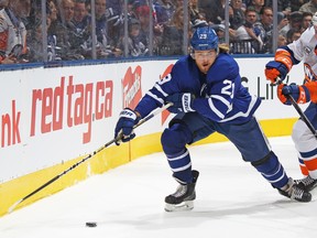 Maple Leafs forward William Nylander carries the puck against the New York Islanders on Saturday night at Scotiabank Arena. Nylander has just two assists since ending his contract holdout at the start of December. (Claus Andersen/Getty Images)