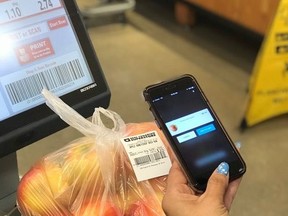 A phone is used to "shop and scan" at a Loblaws location in this undated handout photo. Grocery giant Loblaw launched its phone-based "shop and scan" offering at five Loblaws locations and three Real Canadian Superstores in the Greater Toronto Area in November.