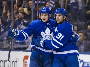Maple Leafs’ Zach Hyman (left) and John Tavares celebrate a goal earlier this season. Hyman will return from a two-game suspension to face the Panthers tonight and he’ll back with his regular linemates, Tavares and Mitch Marner. (Ernest Doroszuk/Toronto Sun File)