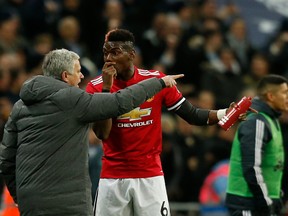Manchester United's manager Jose Mourinho (L) and French midfielder Paul Pogba are on a path to a breakup.  (Photo by Ian KINGTON / Getty Images