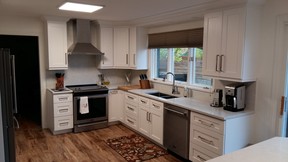 AFTER: The wish list included solid wood, white, Shaker-style cabinets, marble-look quartz countertops and new appliances.