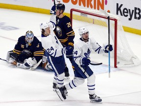 Toronto Maple Leafs forward Auston Matthews (34) puts the puck past Buffalo Sabres goalie Linus Ullmark (35) during the overtime period in Buffalo on Tuesday. (AP Photo/Jeffrey T. Barnes)