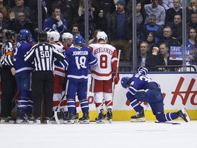 Maple Leafs' Auston Matthews is slow to get up after being run into the boards during the second period in Toronto on Thursday, December 6, 2018. (JACK BOLAND/TORONTO SUN)