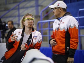 Speedskater Ted-Jan Bloemen, left, speaks with coach Bart Schouten during a training session in Calgary in 2016. THE CANADIAN PRESS FILE