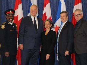 From left, Toronto Police Chief Mark Saunders, Organized Crime Reduction Minister Bill Blair, MP Julie Dabrusin, Mayor John Tory and MP Adam Vaughan at a press conference on Thursday, Dec. 20, 2018. (Antonella Artuso/Toronto Sun)